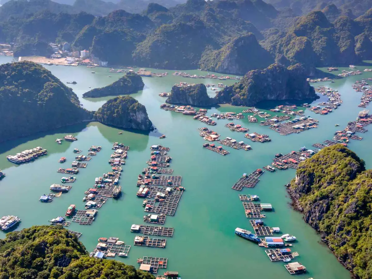 Floating village among limestone islands in Ha Long Bay, Vietnam