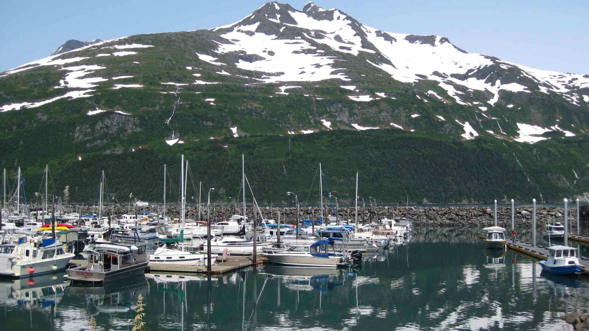 Whittier marina beneath snow-streaked mountains
