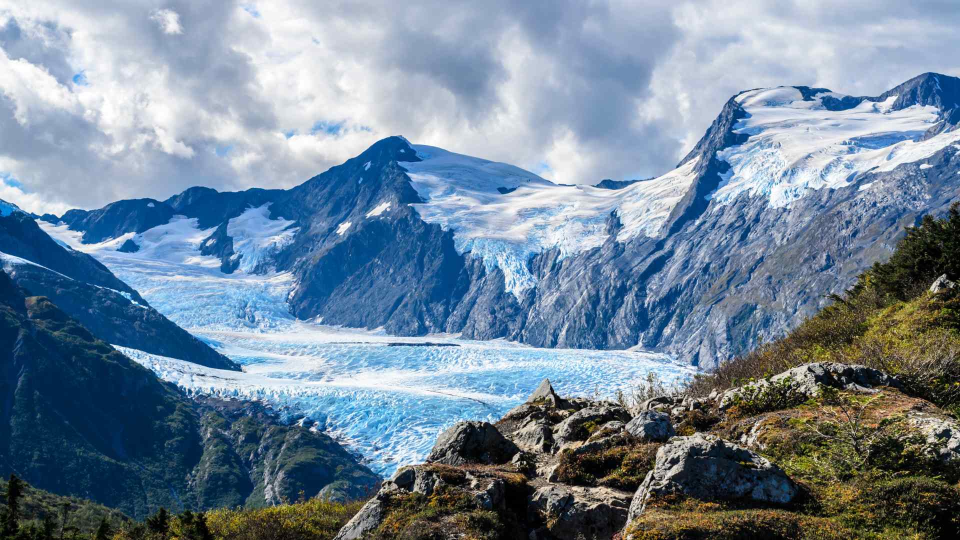 Glacier flowing through mountains near Whittier, Alaska