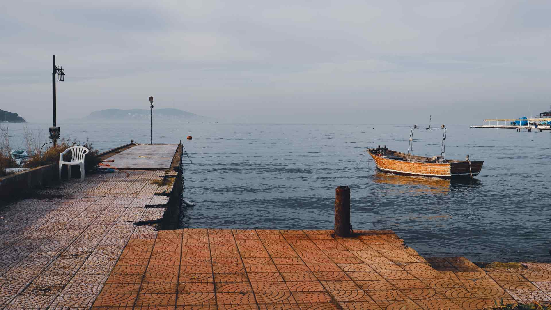 Quiet waterfront pier and small boat near Zeebrugge