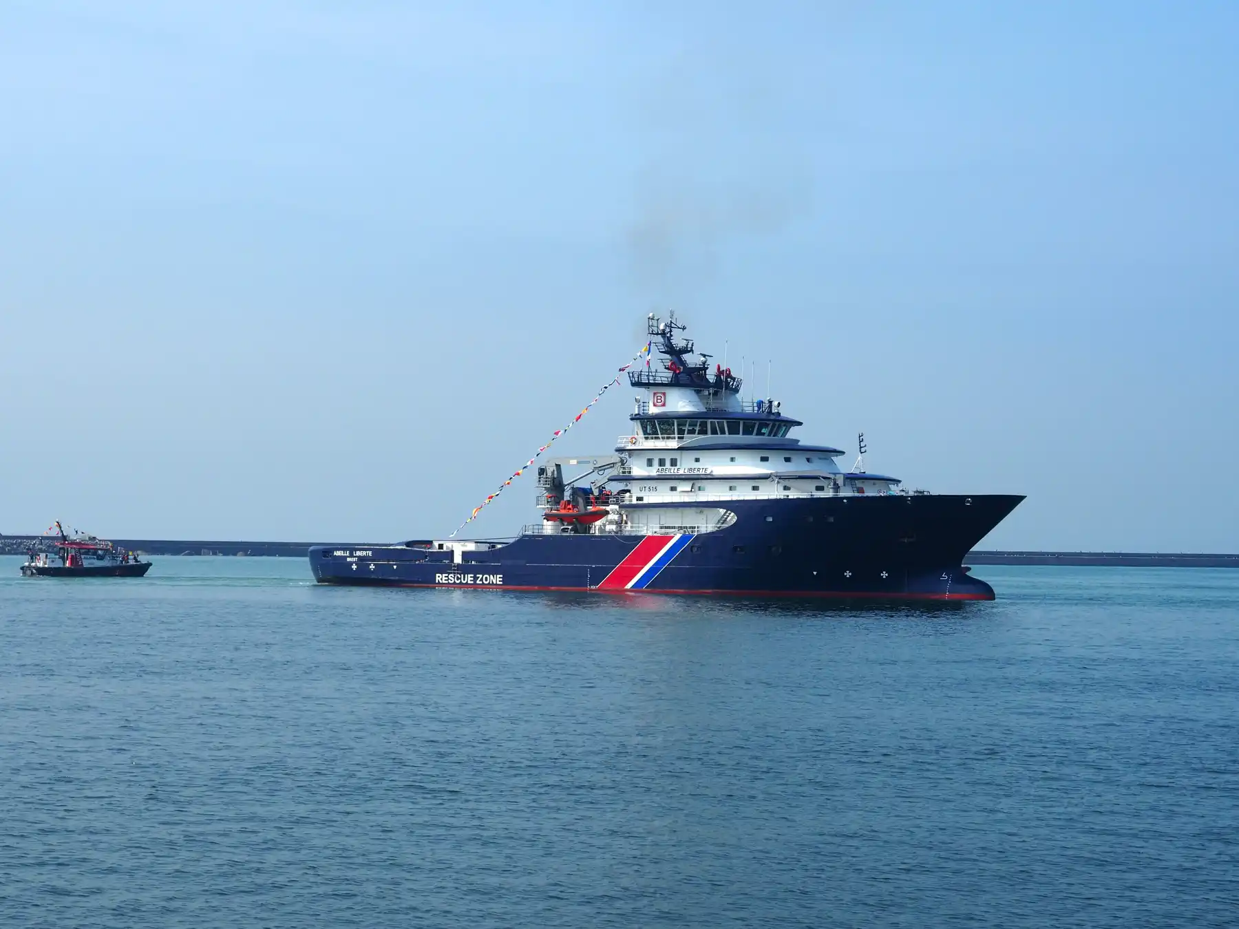 The Abeille Liberté rescue vessel navigating the waters of Le Havre port.