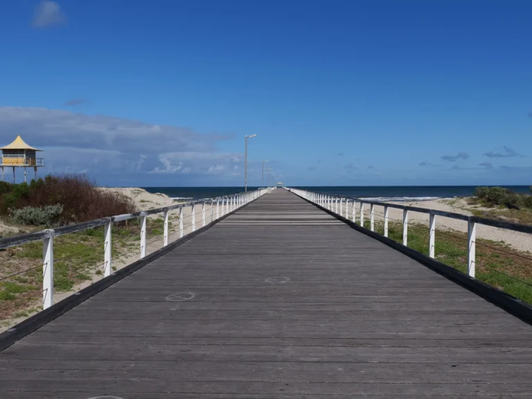 Port Noarlunga jetty reaching into the calm sea near Adelaide, South Australia.