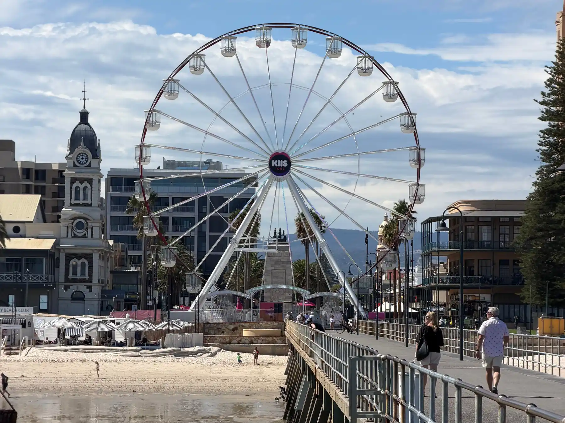 Glenelg Beach ferris wheel and waterfront promenade in Adelaide, South Australia.