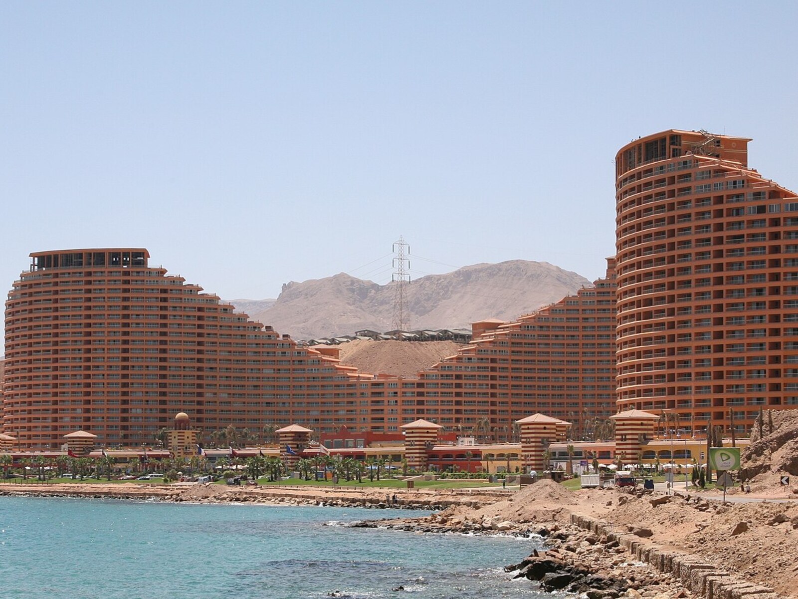 Porto Sokhna resort buildings between desert mountains and the blue Red Sea in Ain Sokhna, Egypt