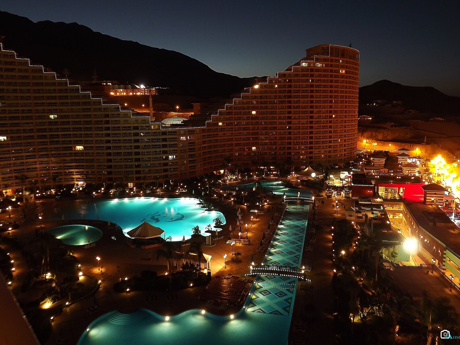 Illuminated pools and resort buildings at night in Ain Sokhna on Egypt’s Red Sea coast