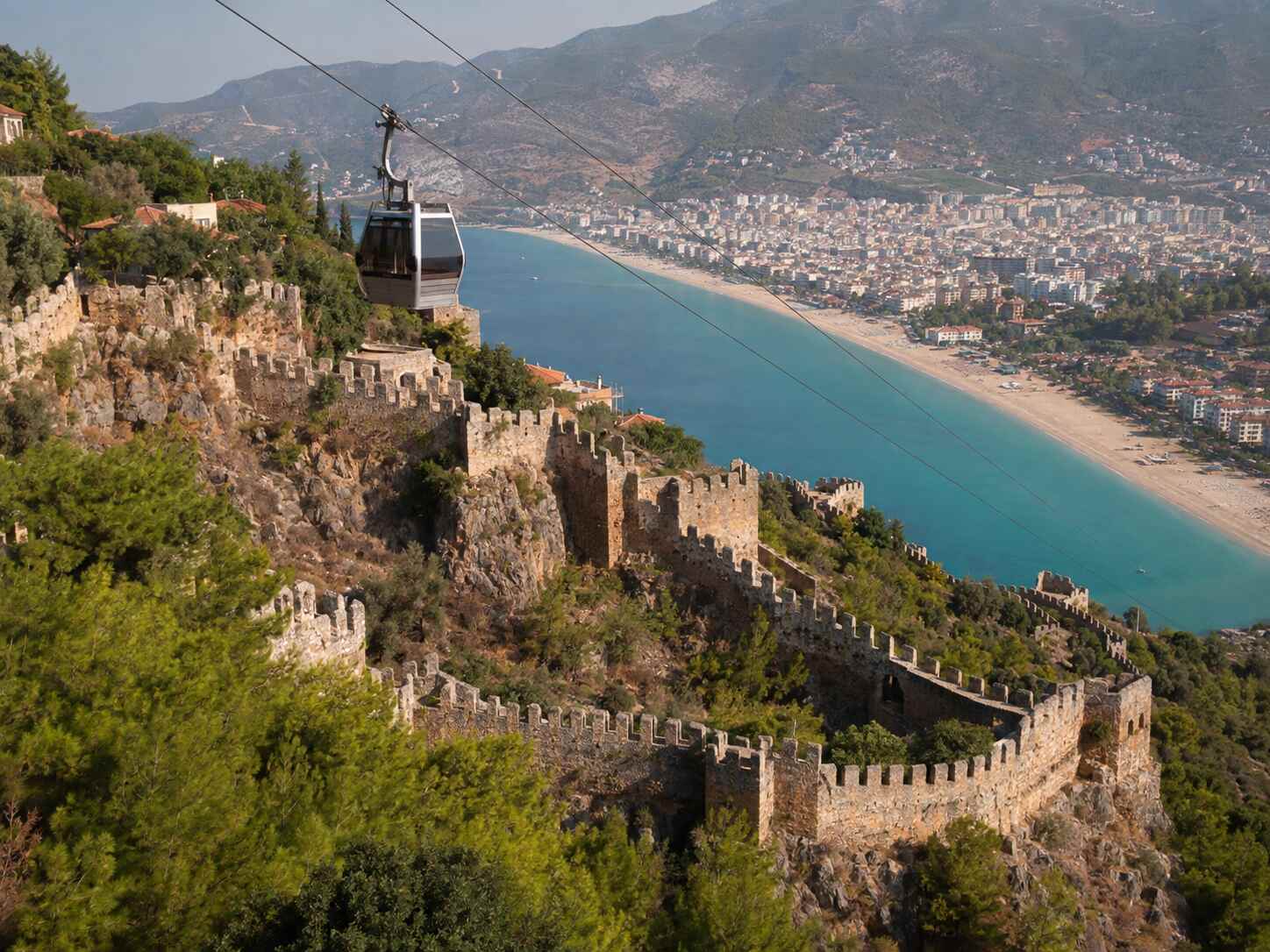 Alanya Castle walls and cable car overlooking Cleopatra Beach and the Mediterranean
