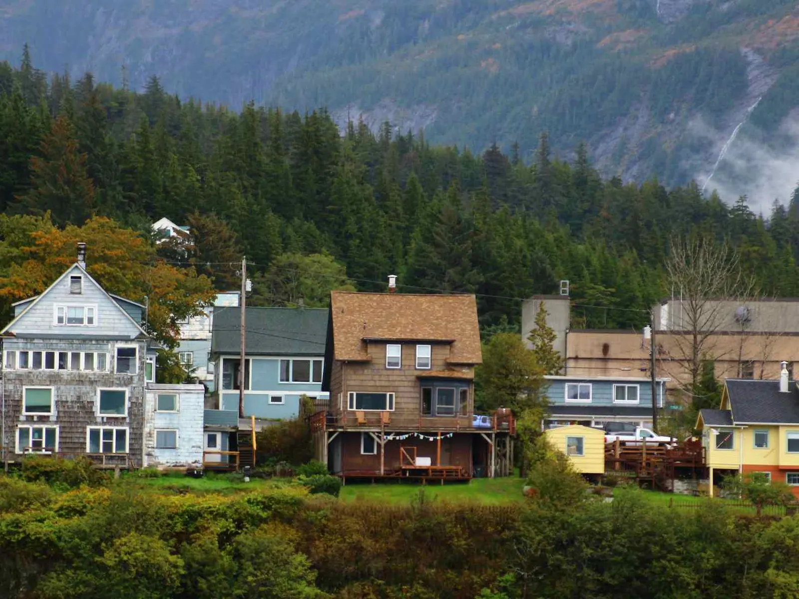 Waterfront homes beneath forested hills near Ketchikan