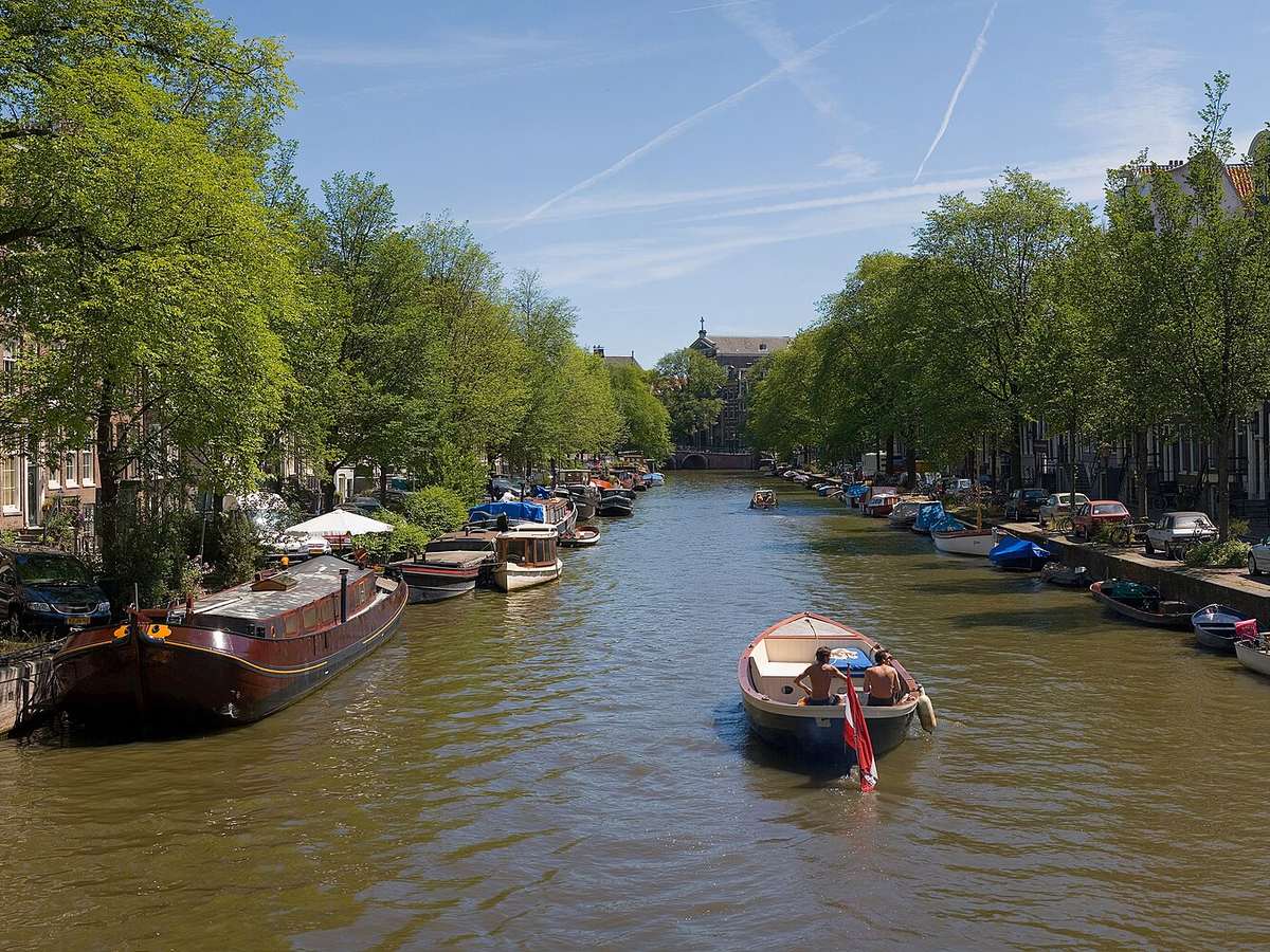 Historic canal houses and boats in Amsterdam