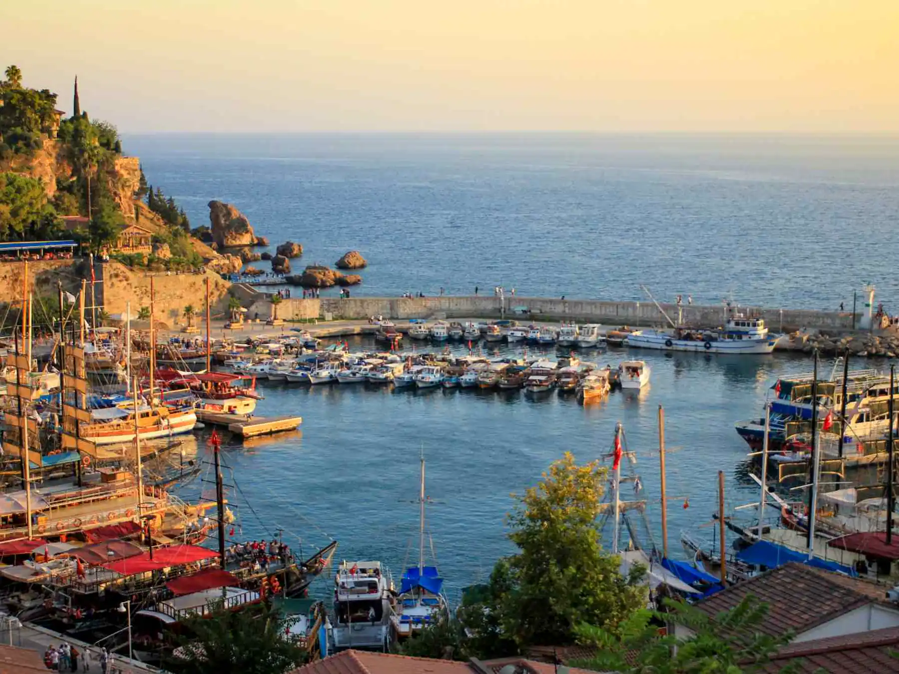 Antalya Old Harbor filled with boats at sunset.