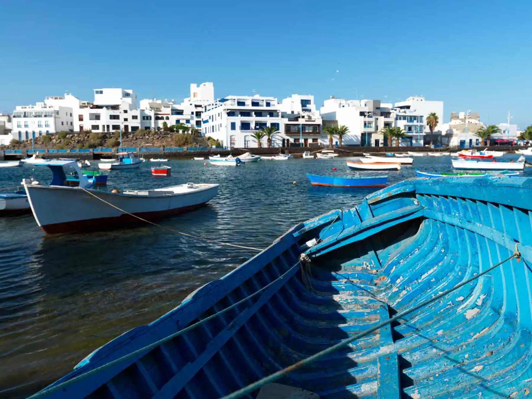 Blue fishing boats inside Arrecife harbor, Lanzarote.