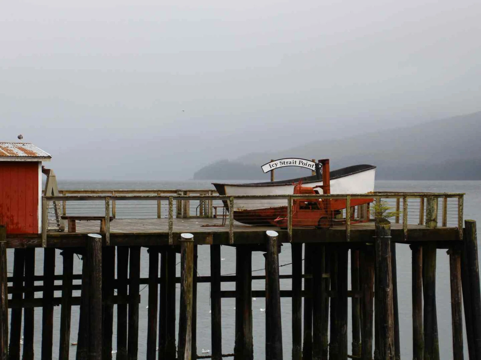 Wooden harbor buildings on pilings at Icy Strait Point