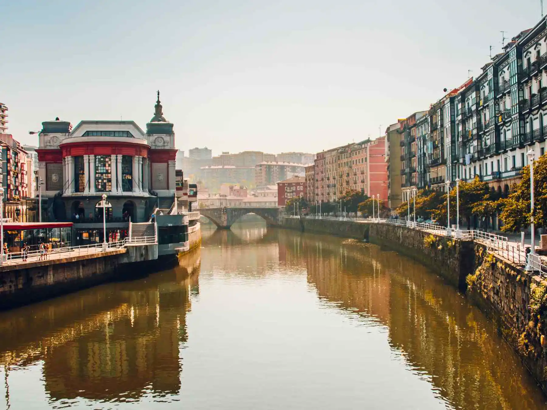 The Nervión River and waterfront buildings through central Bilbao.