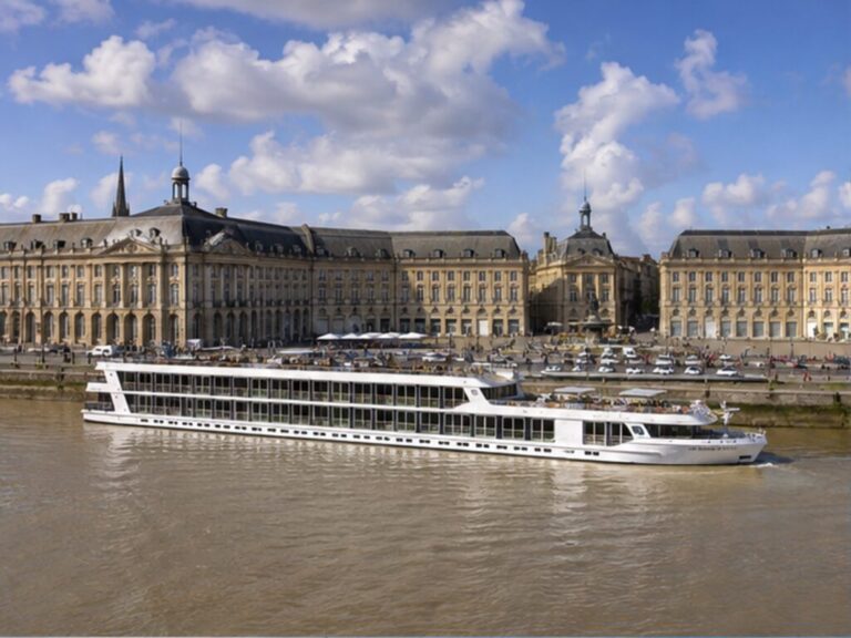 River cruise ship on Bordeaux's tidal Garonne waterfront near the Place de la Bourse