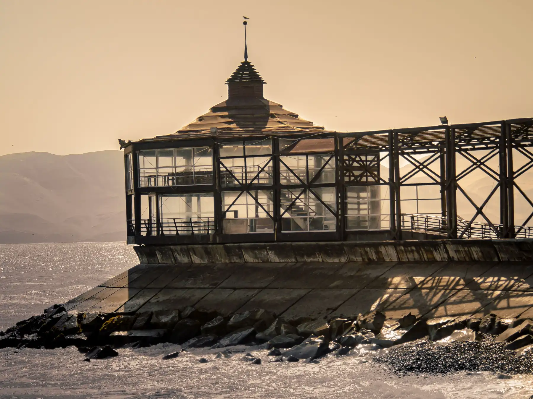 Mirador de La Punta pavilion on the Callao waterfront at sunset.