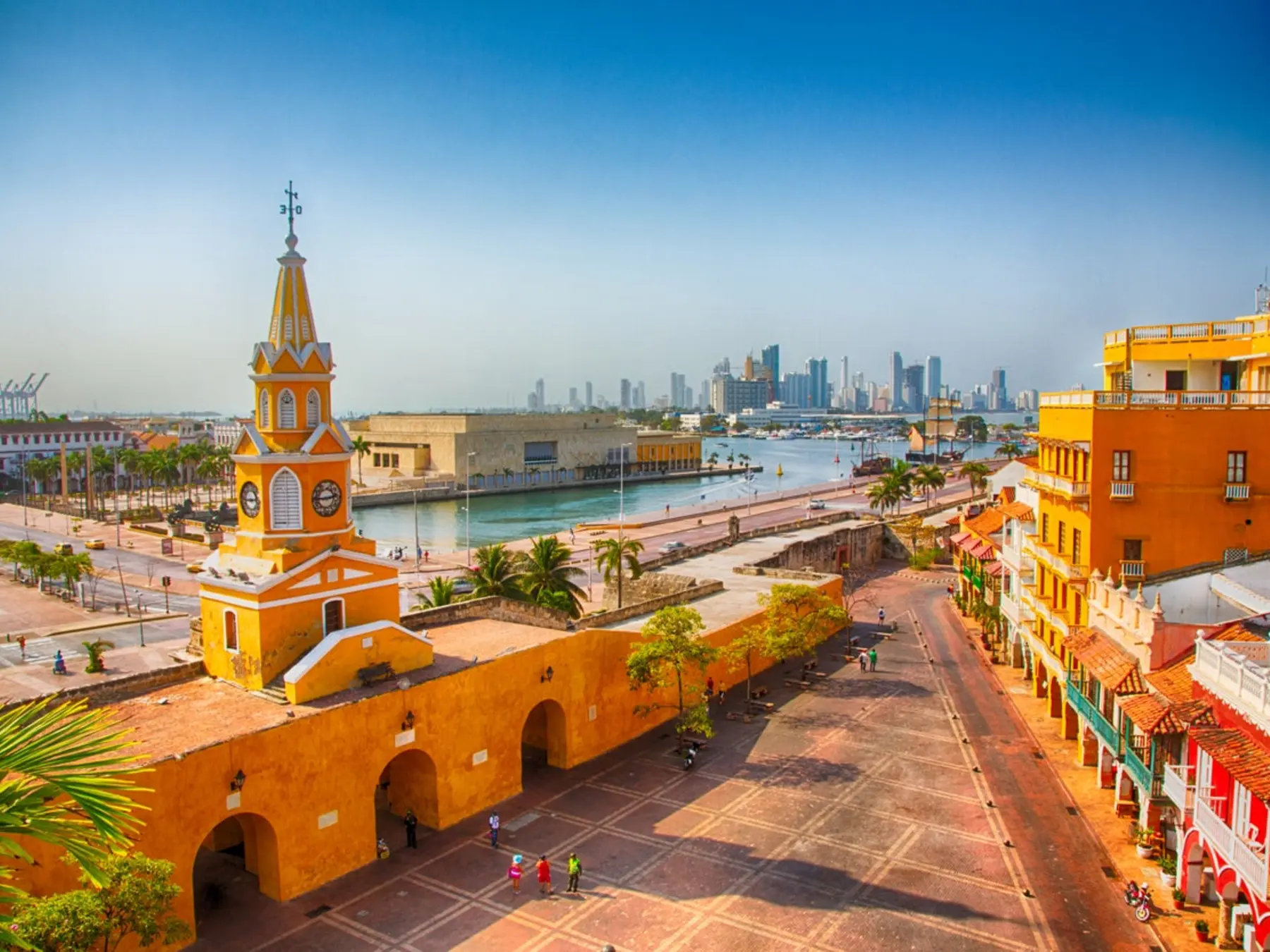 Cartagena's yellow clock tower overlooking the historic waterfront and harbor.