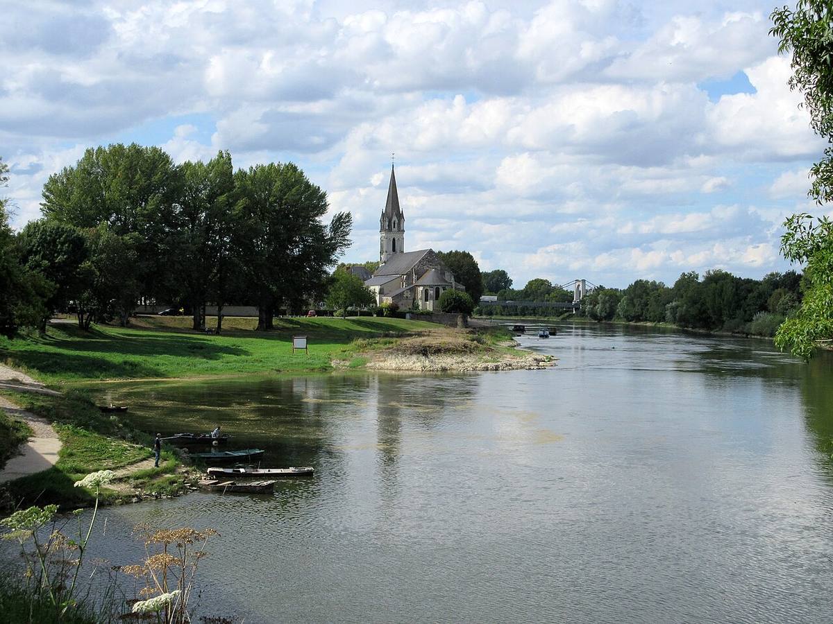 Loire riverbank, small boats, Saint-Maurille church, and bridge at Chalonnes-sur-Loire