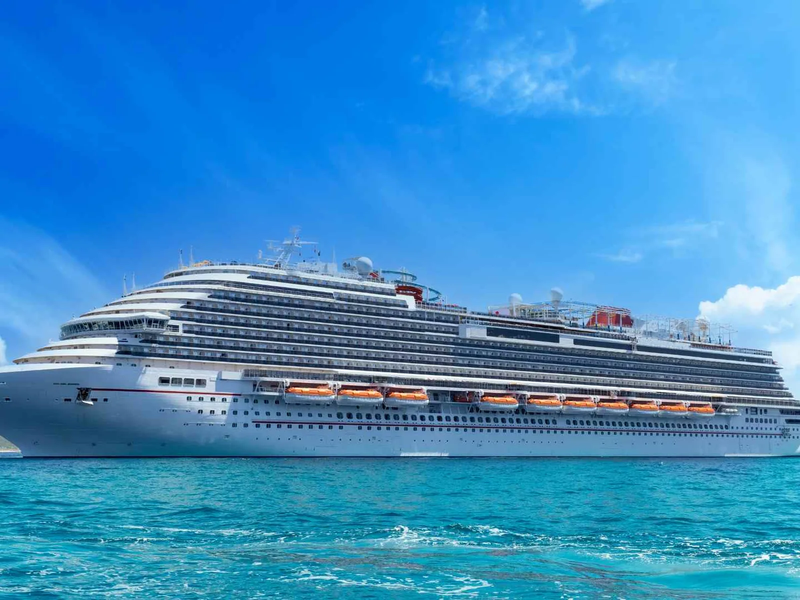 Cruise ship sailing through bright blue water off Mexico