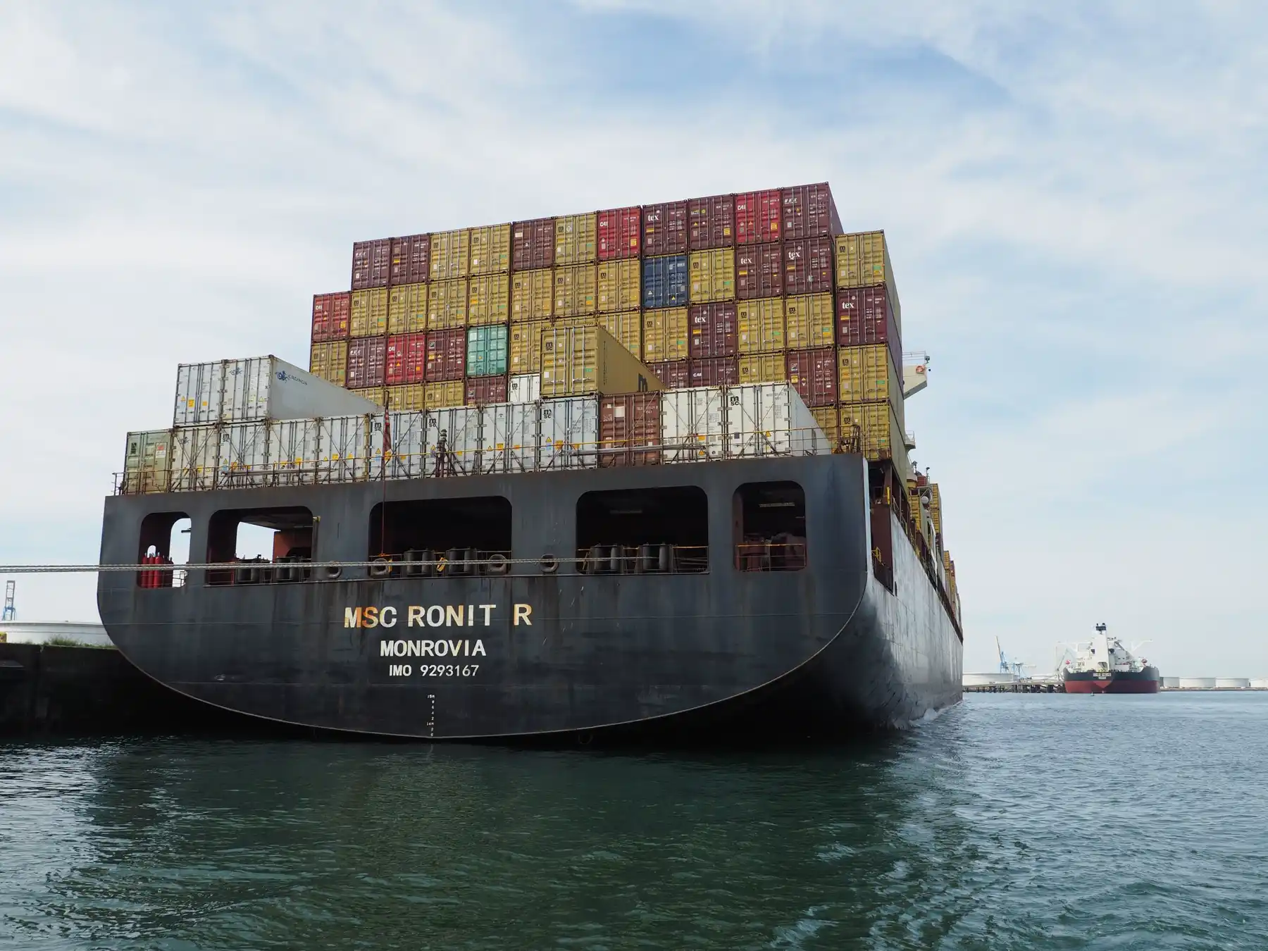 A large container ship docked in the commercial port of Le Havre.