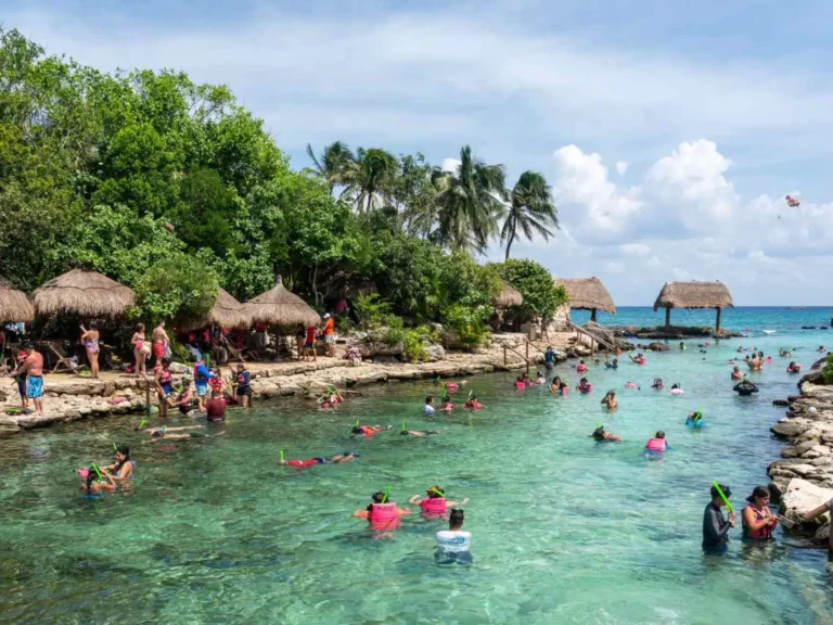 Travelers swimming in a sheltered lagoon at Costa Maya