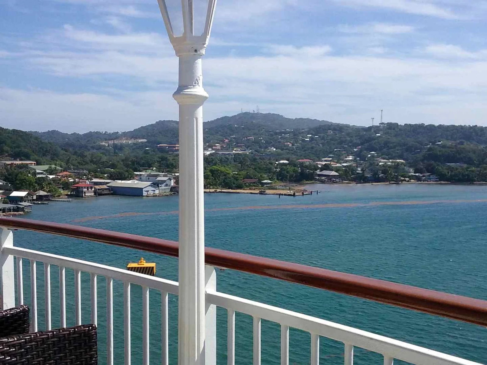 Roatan harbor viewed across the railing of a cruise ship