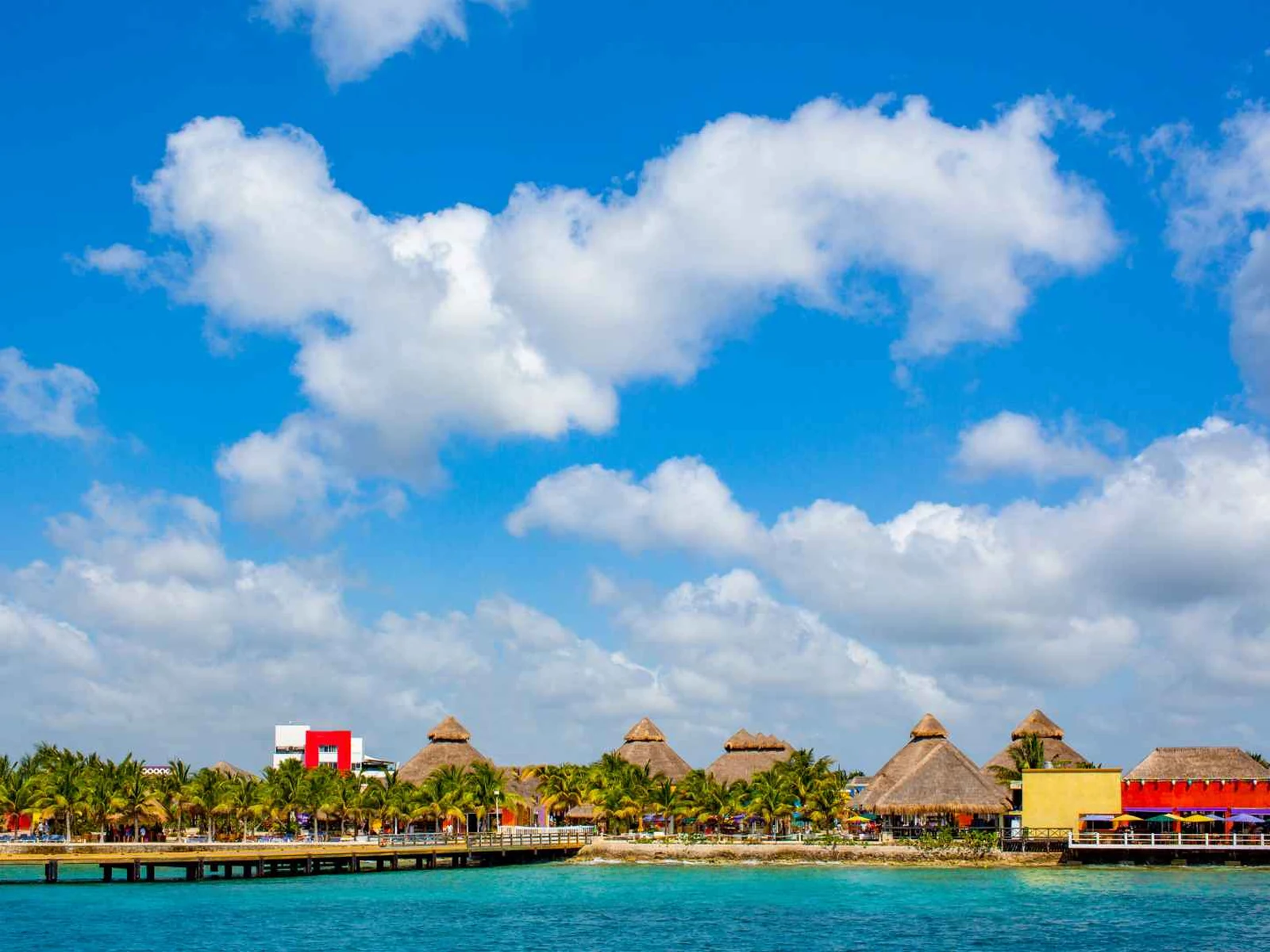 Cozumel cruise terminal and Mexican flag beneath a blue sky