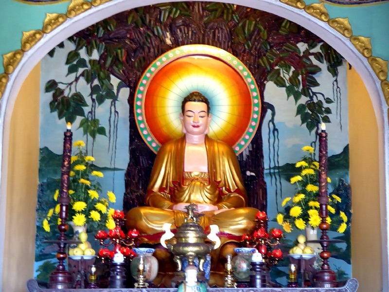 Golden Buddha shrine inside a temple at the Marble Mountains near Da Nang