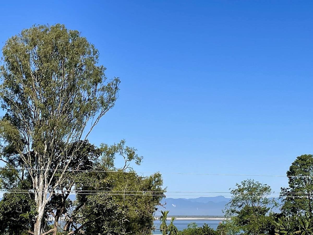 View of the Arunachal hills and the Brahmaputra River on a clear day from the terrace of a house in Dibrugarh at Dibrugarh, Assam, India