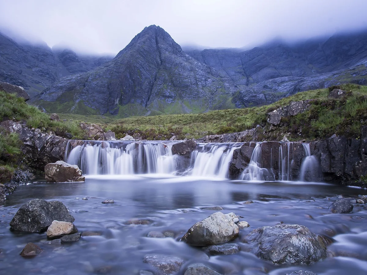 Clear Fairy Pools and mountain landscape on the Isle of Skye