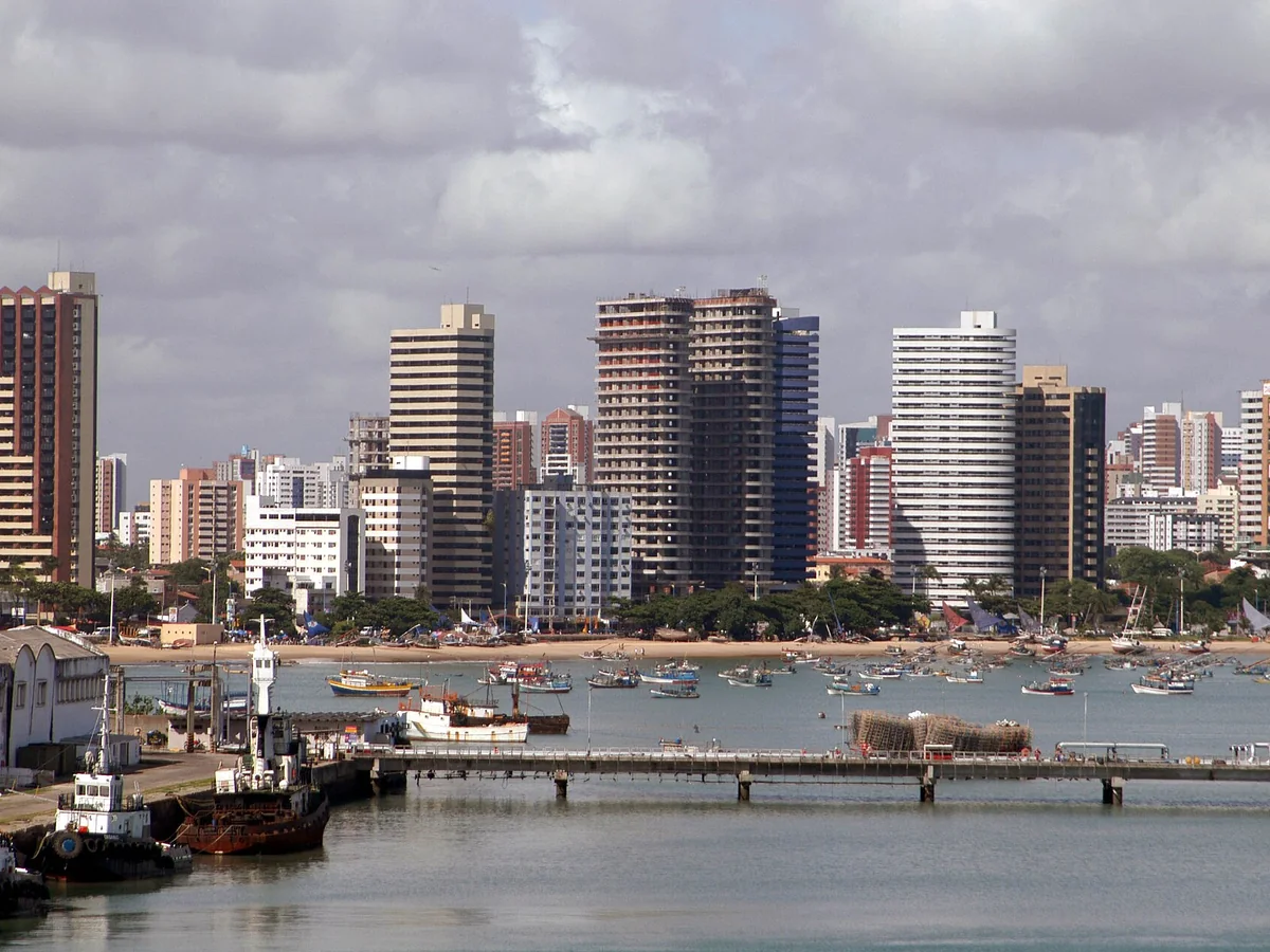 Fortaleza skyline and fishing boats seen from the waterfront near Mucuripe Port