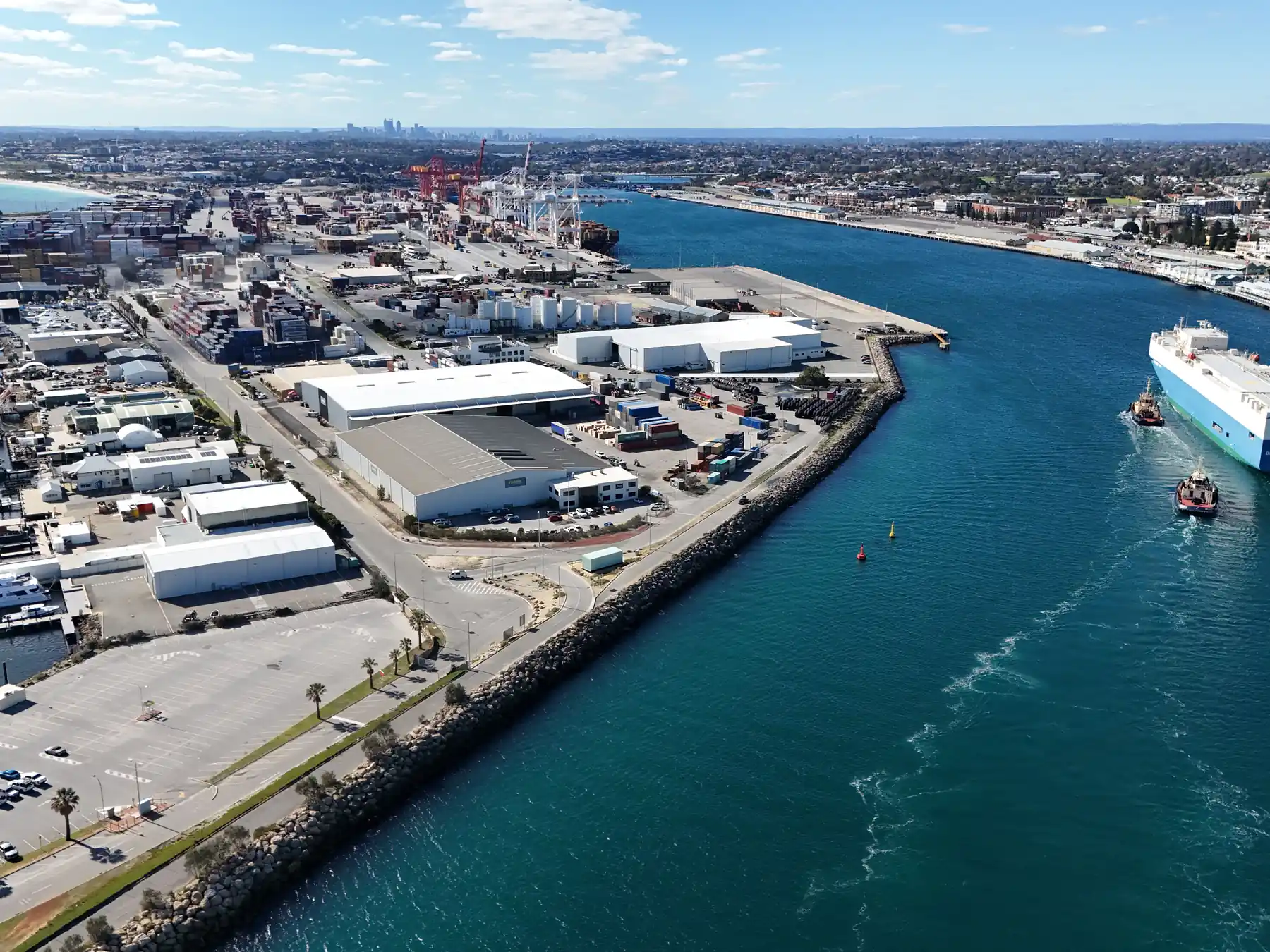 Aerial view of ships, cranes, and cargo facilities at Fremantle Port in Western Australia.