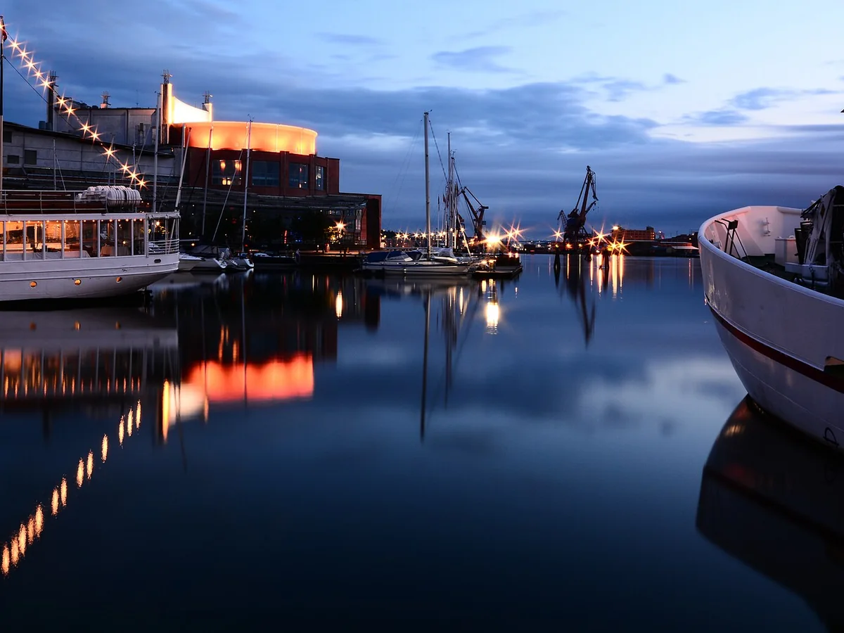Boats and harbour lights reflected in the water at Gothenburg