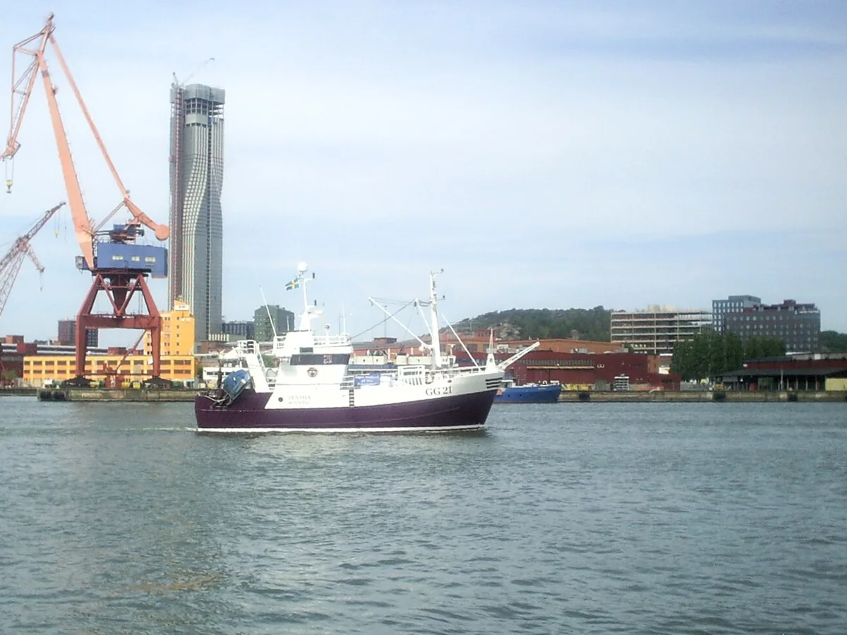 Working vessels and historic cranes in Gothenburg Harbour viewed from Stenpiren