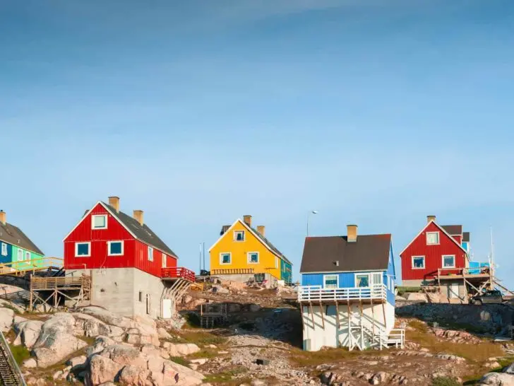 Colorful wooden homes on the rocky coast in Ilulissat, Greenland