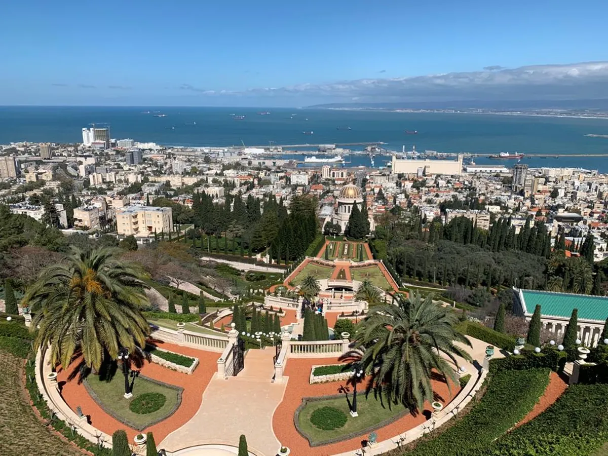 Terraced Baháʼí Gardens descending toward Haifa Port and the bay