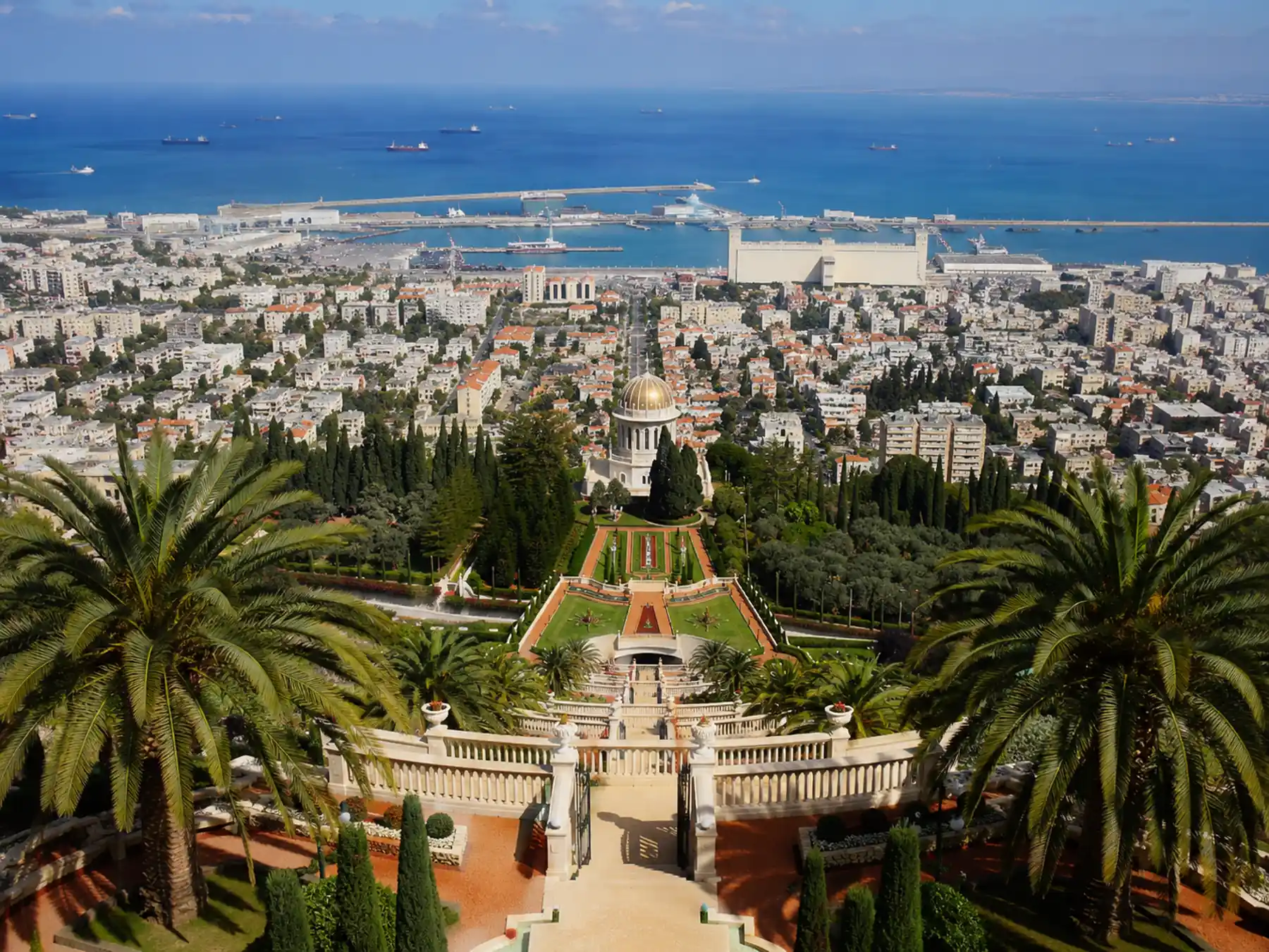 The Baháʼí Gardens terraces in Haifa with the Mediterranean harbor beyond.