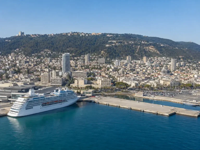 Cruise ship at Haifa harbor with Mount Carmel rising behind.