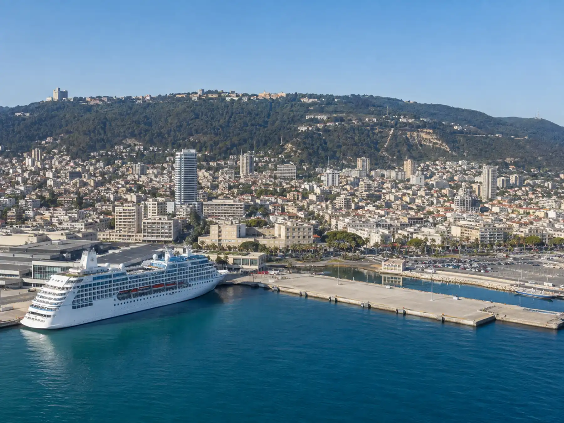 Cruise ship at Haifa harbor with Mount Carmel rising behind.