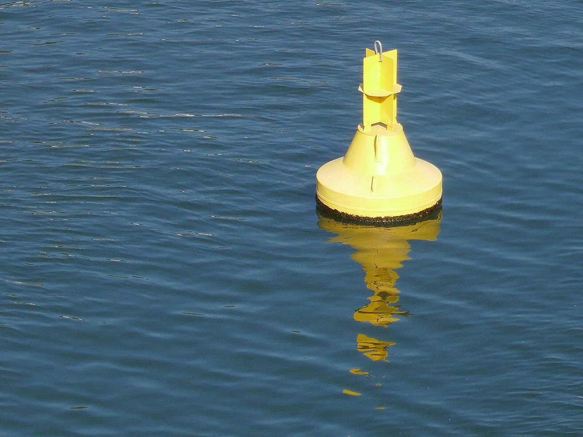 Yellow buoy on blue Neckar river, Heidelberg, D in Heidelberg, Germany