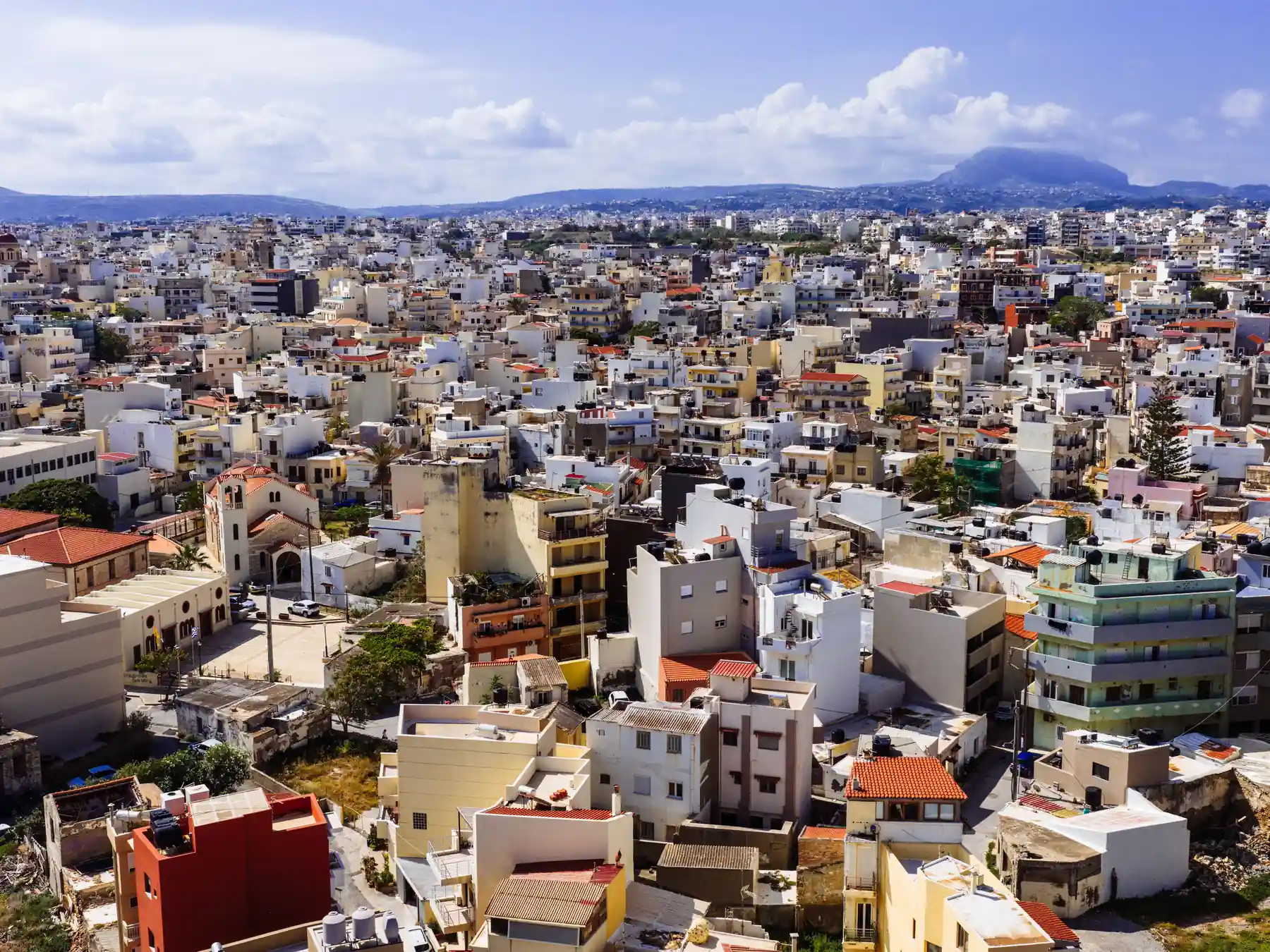 Aerial view across Heraklion city toward the mountains of Crete