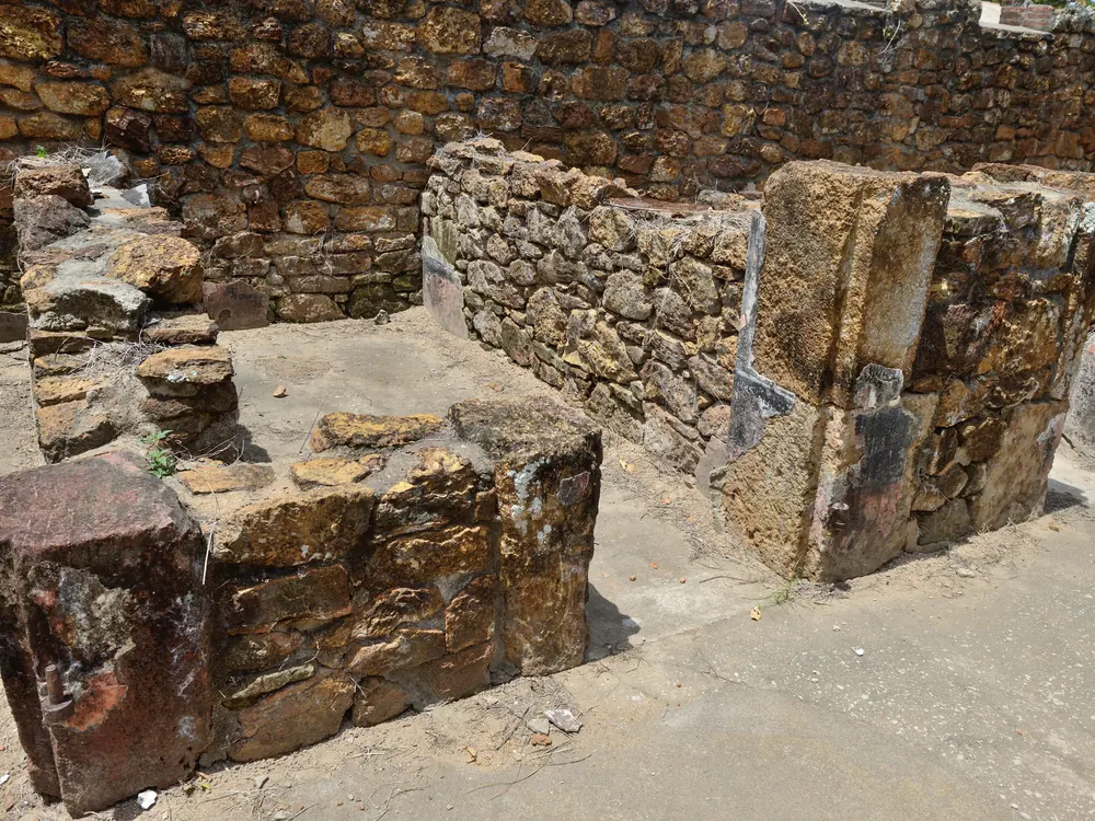 Stone ruins of former prison cells on Île Royale in French Guiana