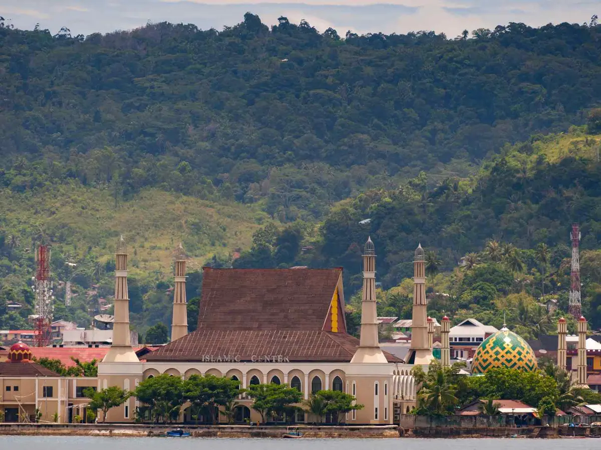 Ambon Waterfront Mosque and green hills along the Ambon waterfront in Indonesia