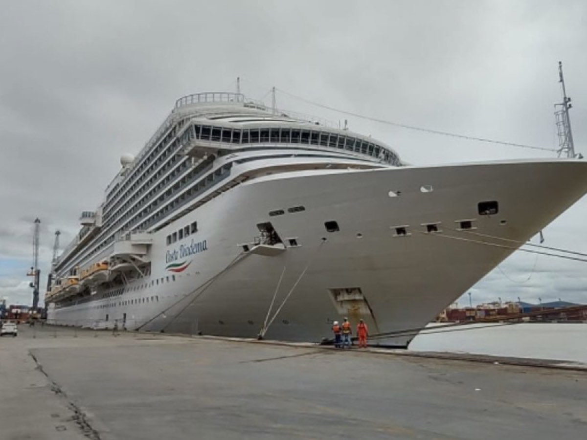 Large cruise ship moored at a working quay in the Port of Itajaí