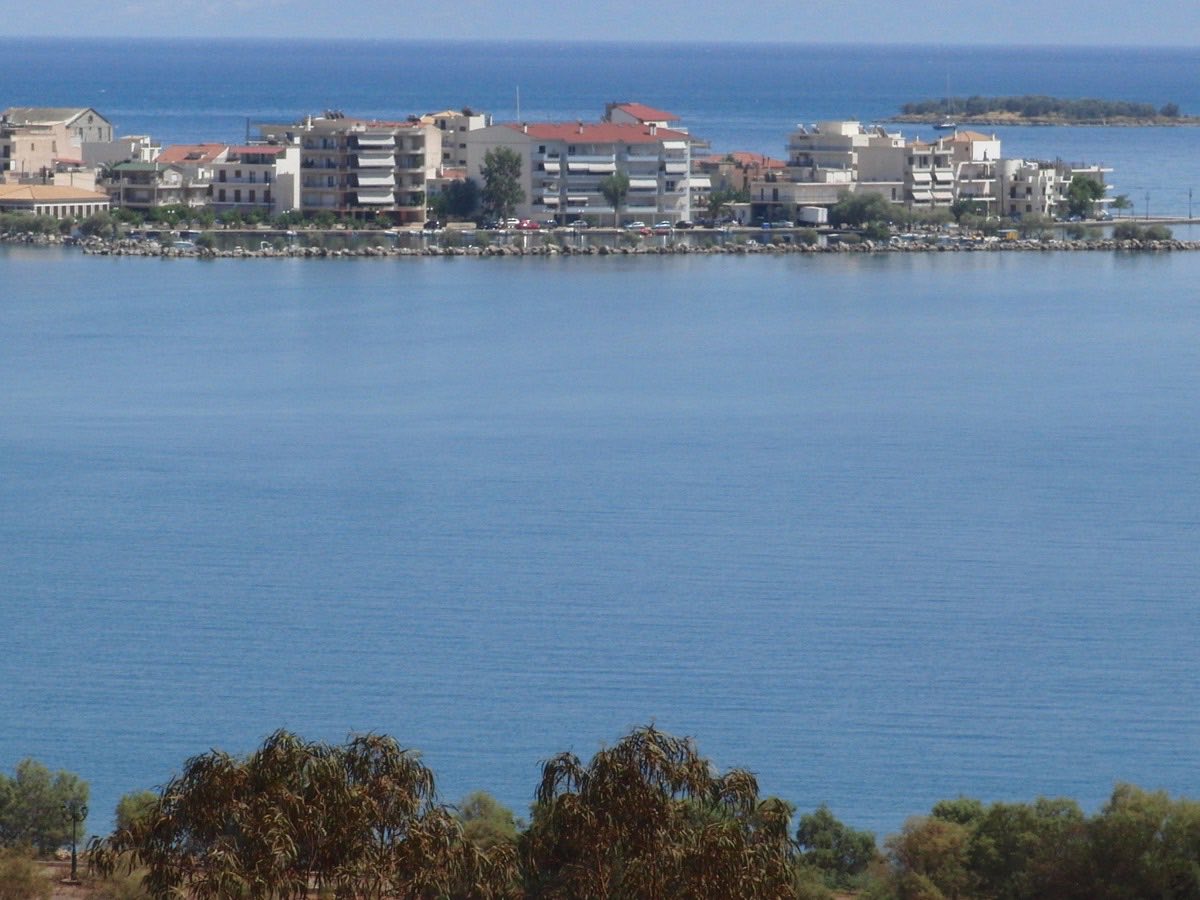 Itea seafront buildings viewed across the calm gulf