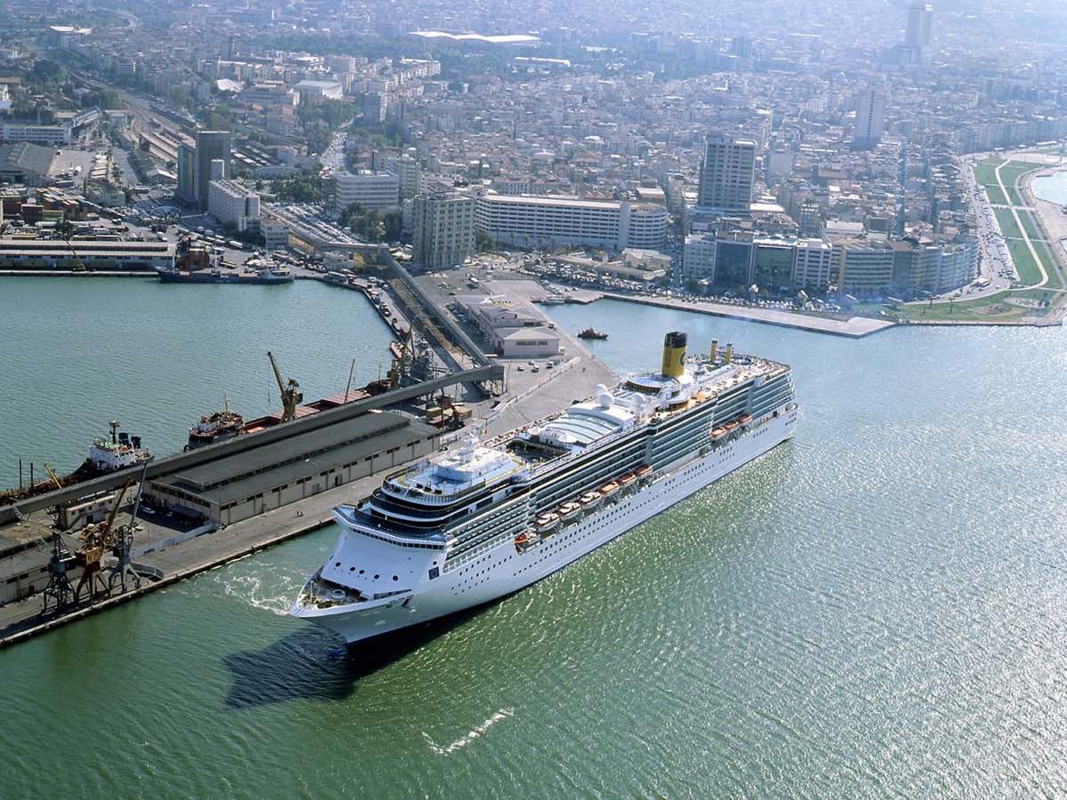 Aerial view of a cruise ship at İzmir port beside the city waterfront