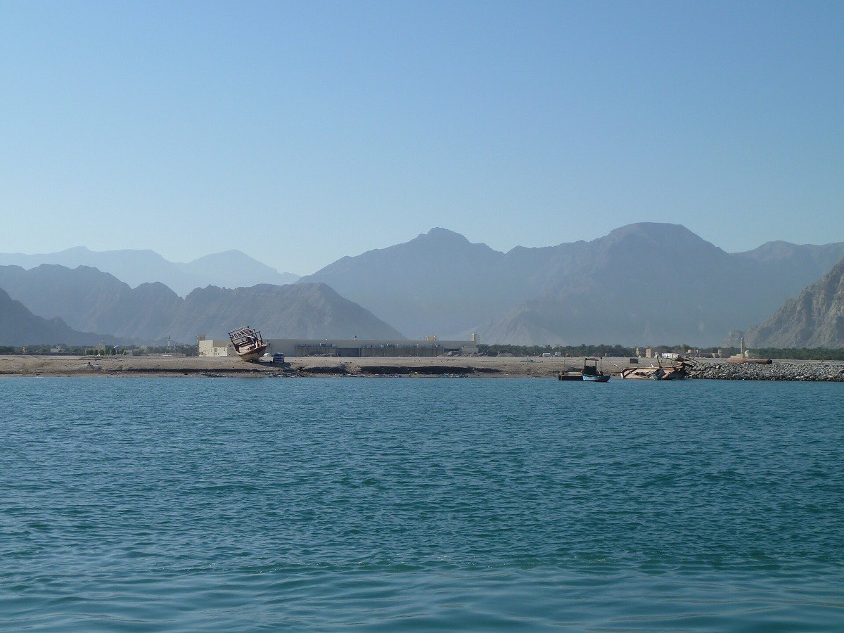 Small boats on the Khasab waterfront with the Musandam Mountains behind