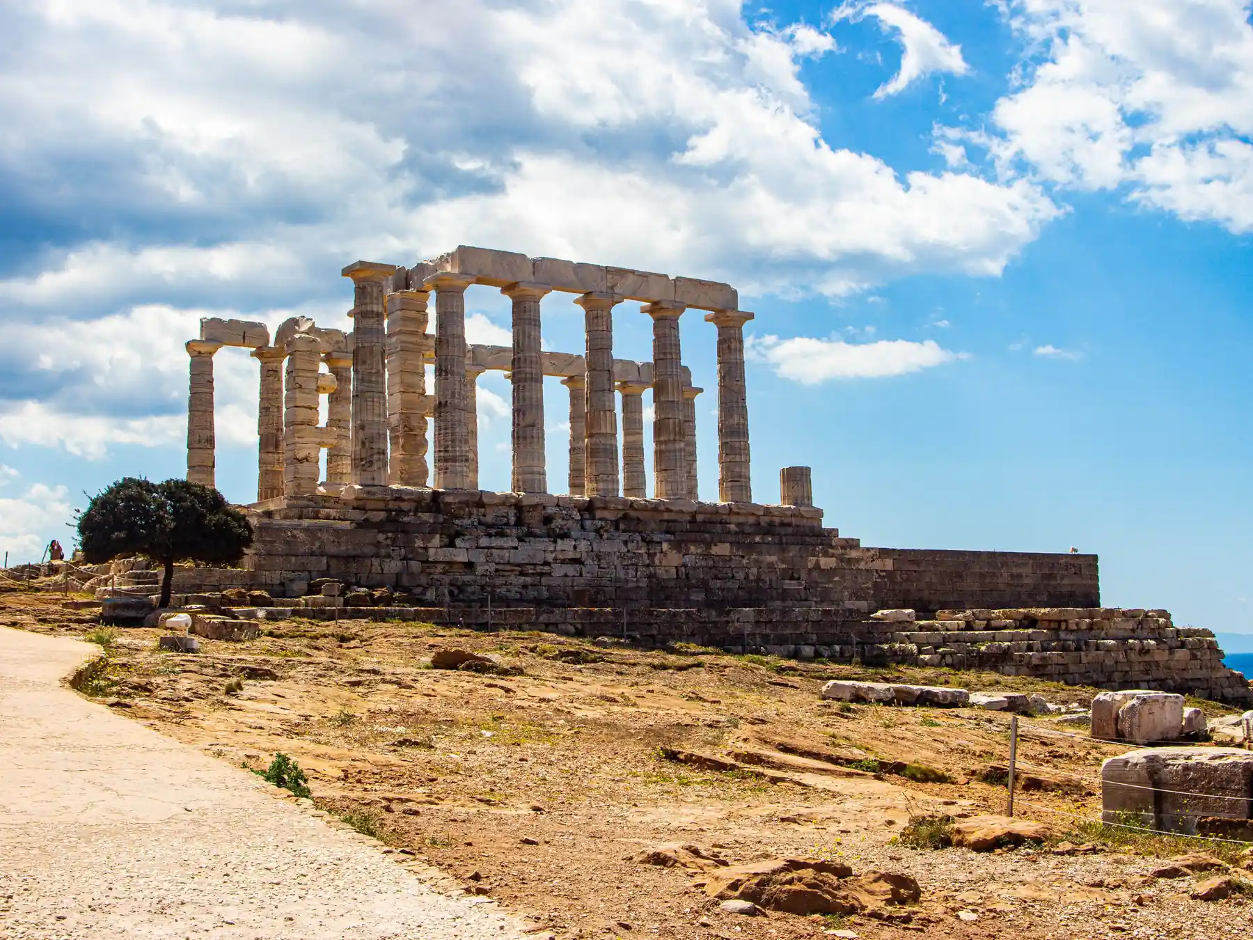 Temple of Poseidon at Cape Sounion under a vivid blue sky