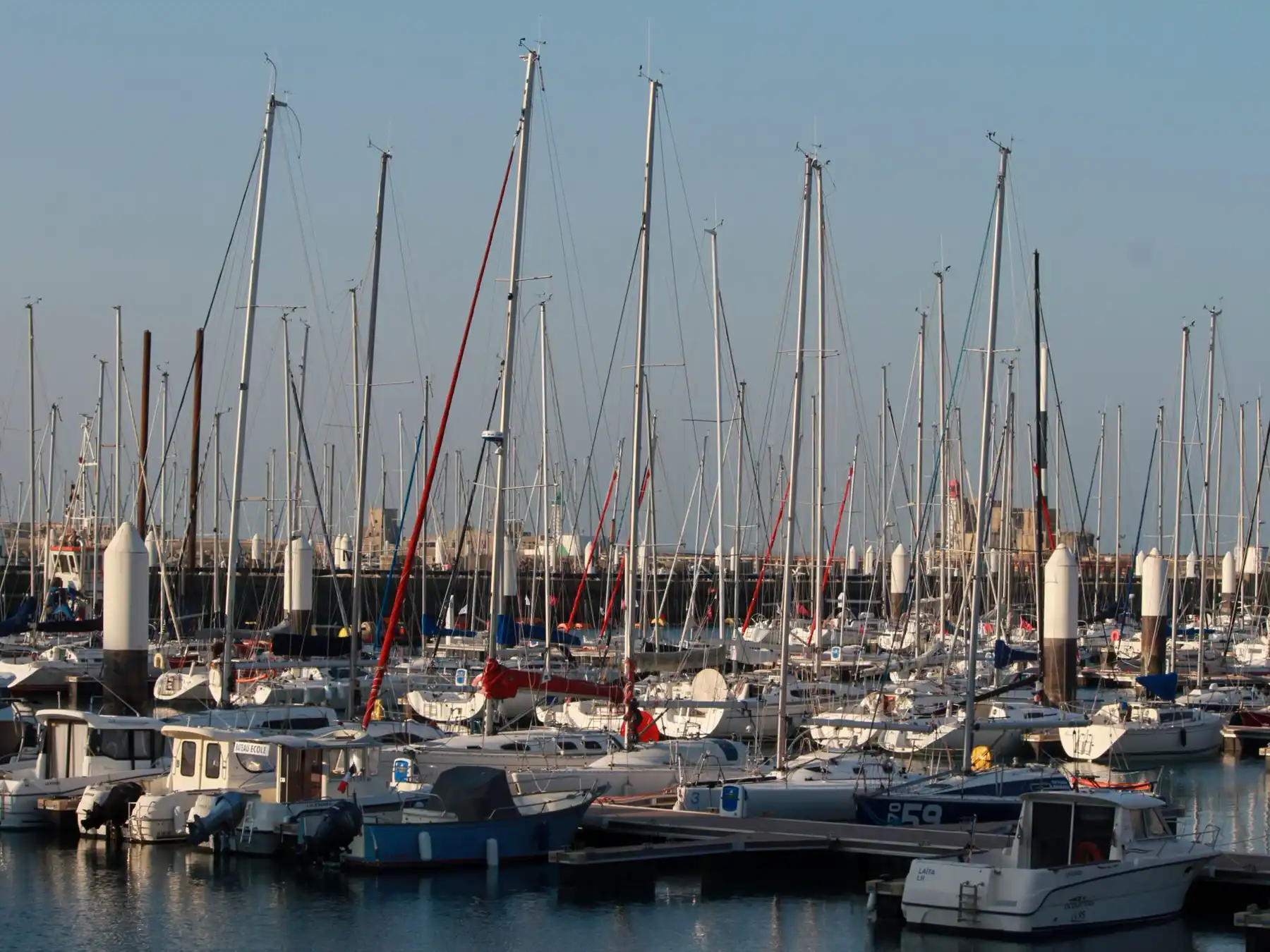 Sailboats and motorboats moored at Le Havre Marina in Normandy.