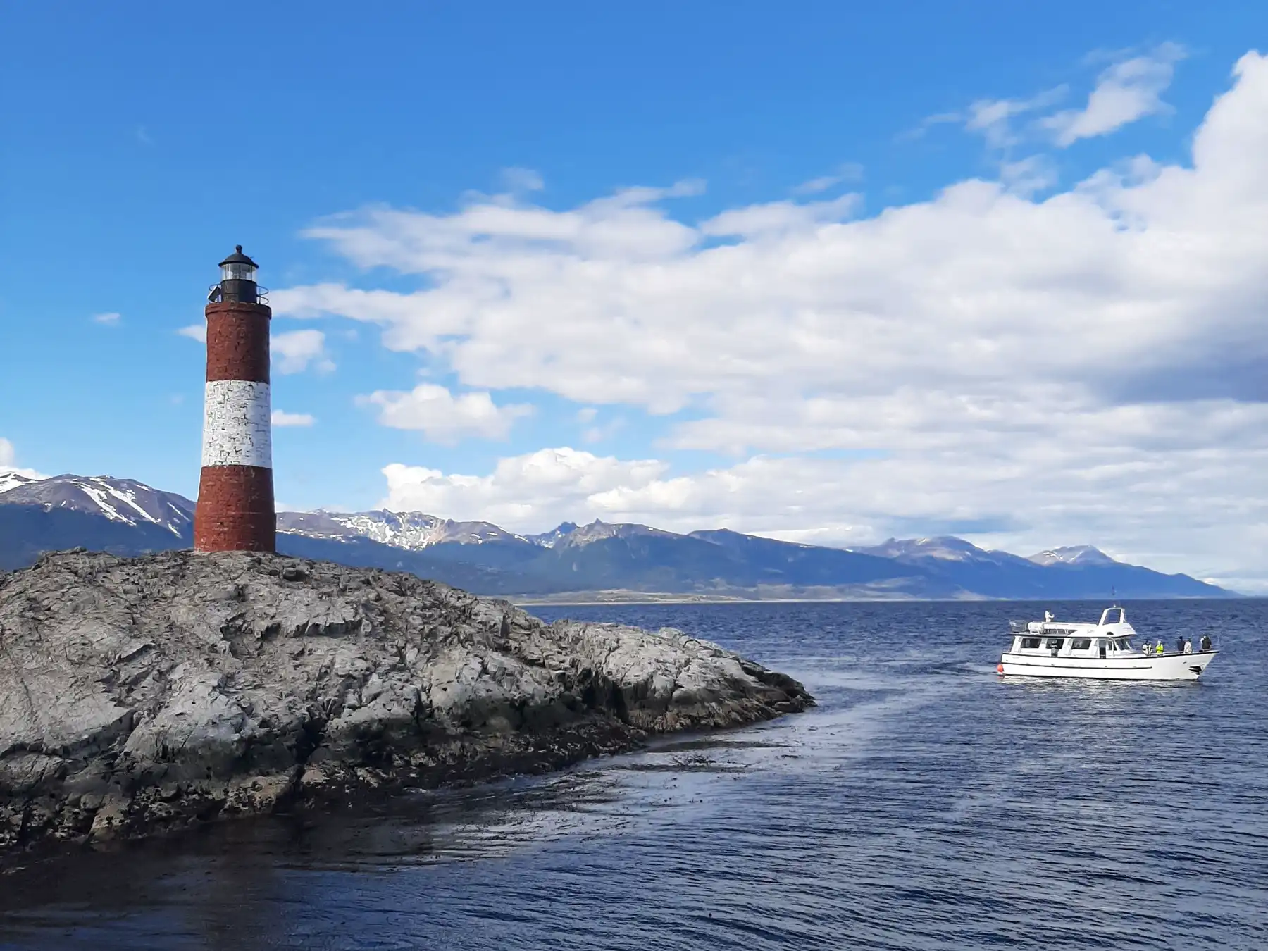 Red and white Les Eclaireurs Lighthouse in the Beagle Channel near Ushuaia.
