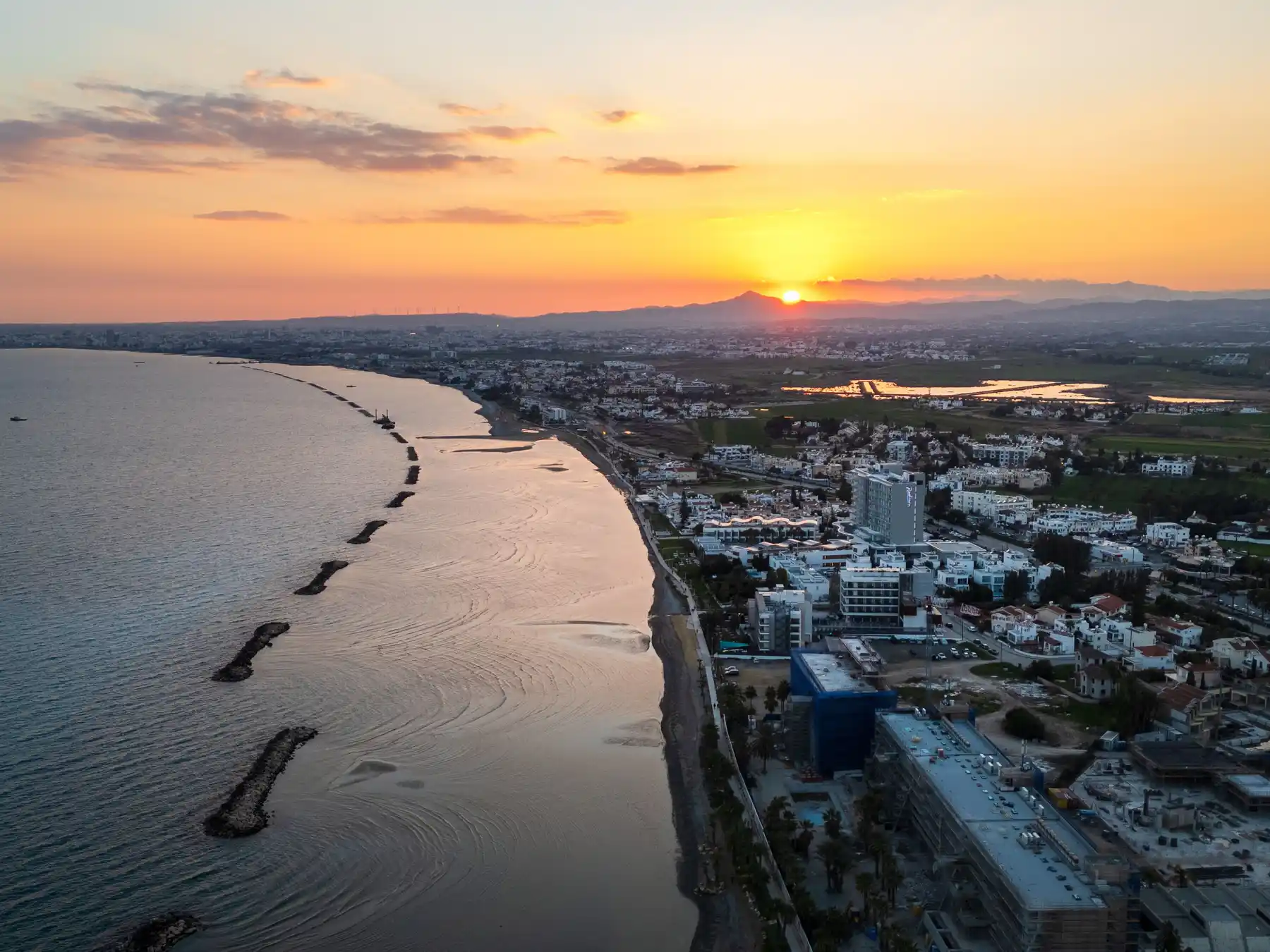 Sunset over the Mediterranean shoreline and waterfront in Limassol, Cyprus.