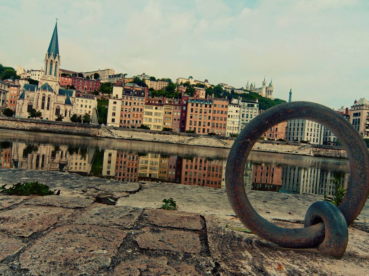 Lyon riverfront and hillside reflected in the Saone